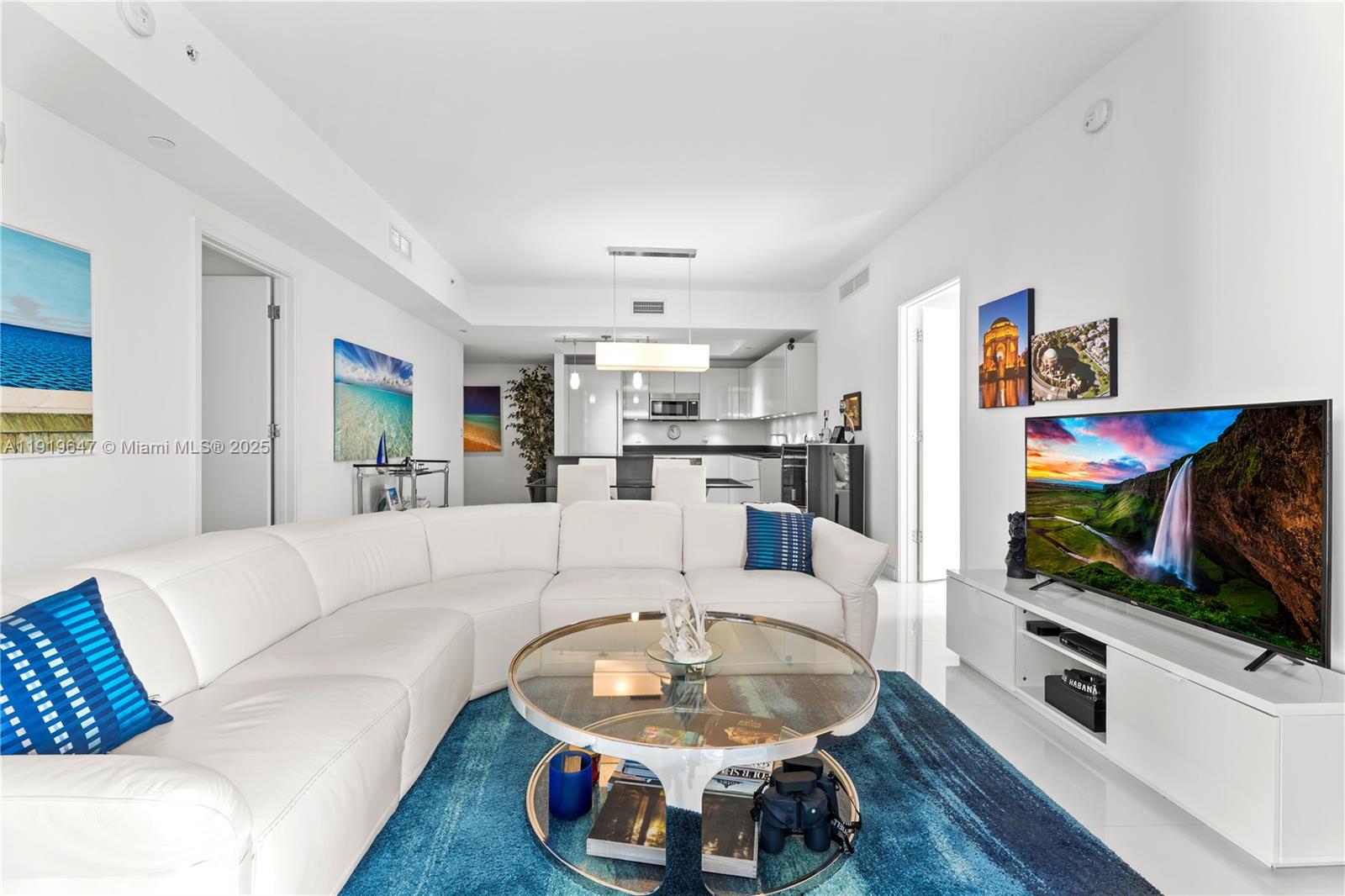 1010 Brickell Avenue, Unit 4206 Miami, FL 33131 - Photo 4 of 33 a living room with furniture and a flat screen tv