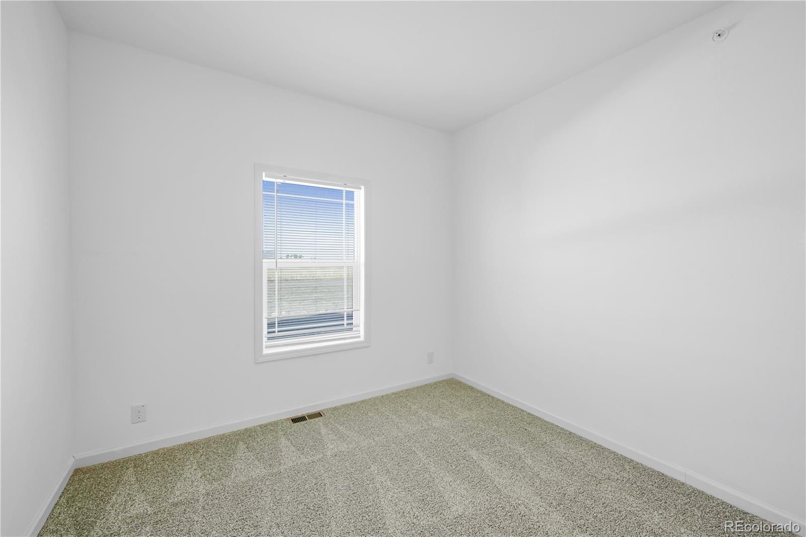 6 Timberlake Road Byers, CO 80103 - Photo 11 of 18 a view of an empty room with a window