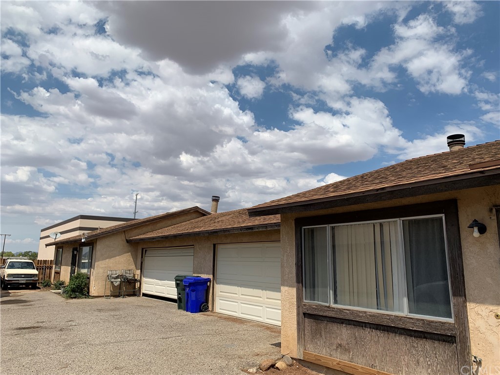 21130 Laguna Road Apple Valley, CA 92308 - Photo 1 of 1 a front view of a house