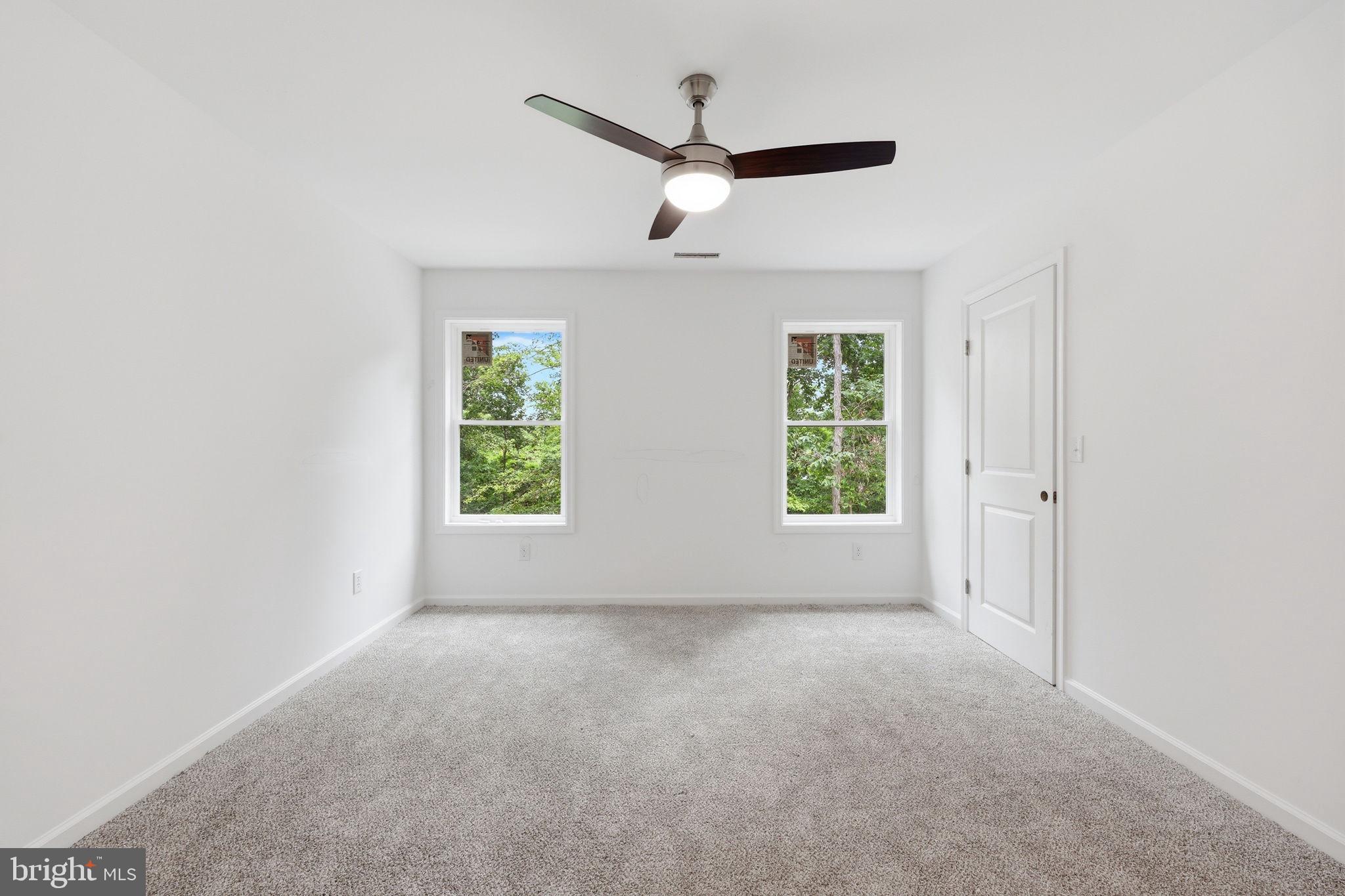 10339 Back Creek Valley Road Hedgesville, WV 25427 - Photo 32 of 48 a view of room with window and ceiling fan