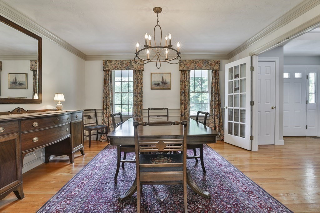 4 Breezy Point Road Acton, MA 01720 - Photo 15 of 40 a view of a dining room with furniture window and wooden floor