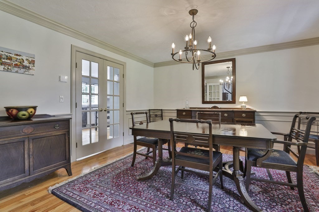 4 Breezy Point Road Acton, MA 01720 - Photo 16 of 40 a view of a dining room with furniture and wooden floor