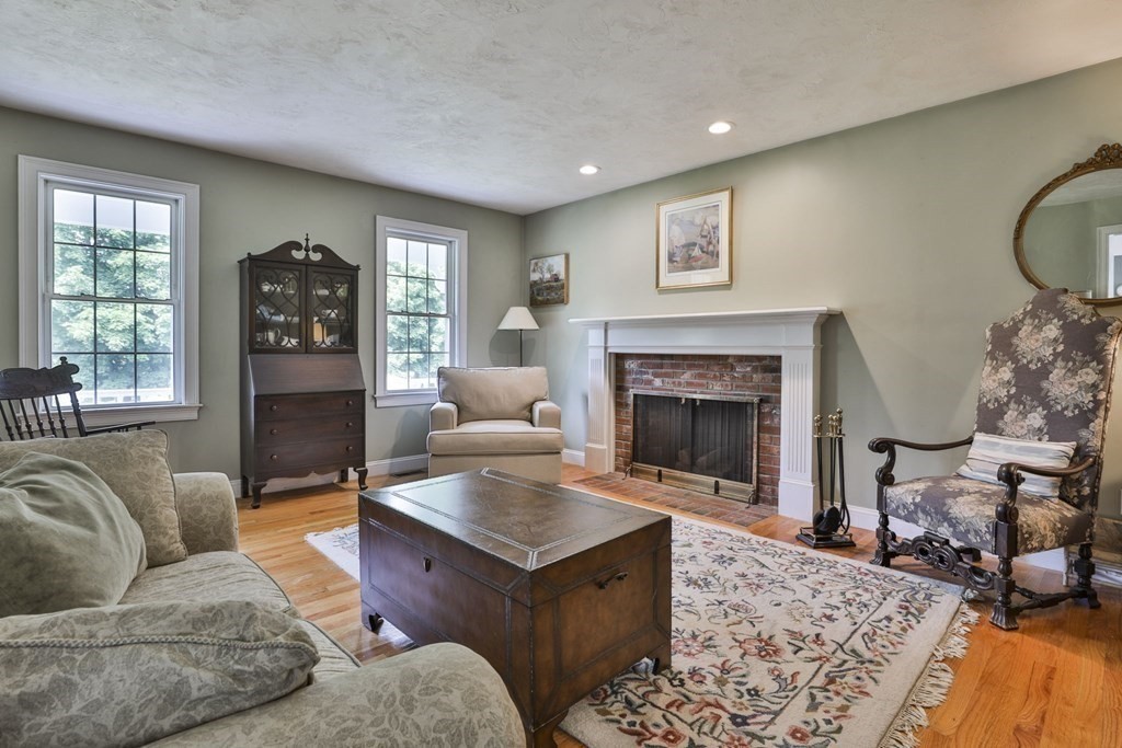 4 Breezy Point Road Acton, MA 01720 - Photo 17 of 40 a living room with furniture and a fireplace