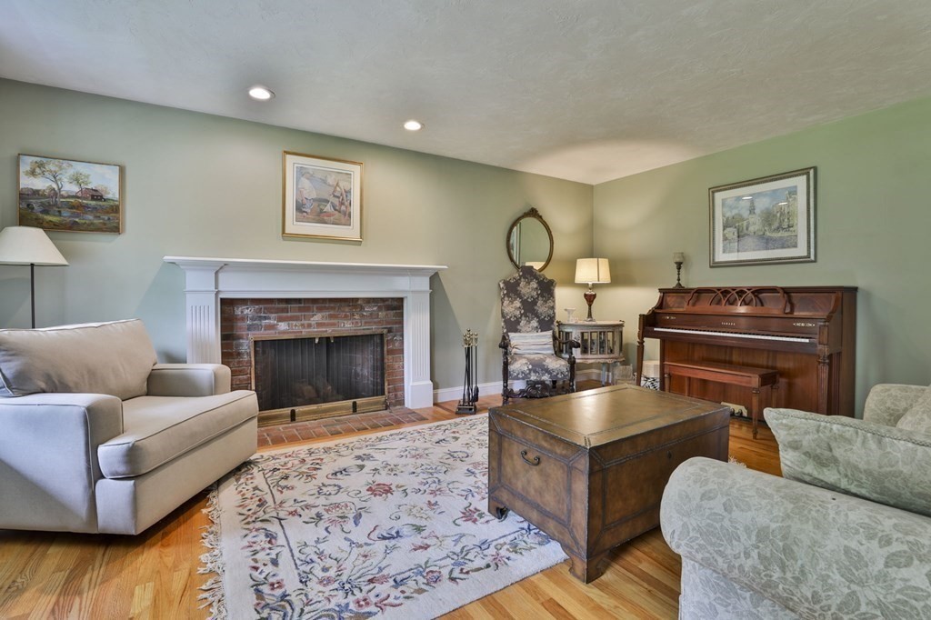 4 Breezy Point Road Acton, MA 01720 - Photo 19 of 40 a living room with furniture and a fireplace