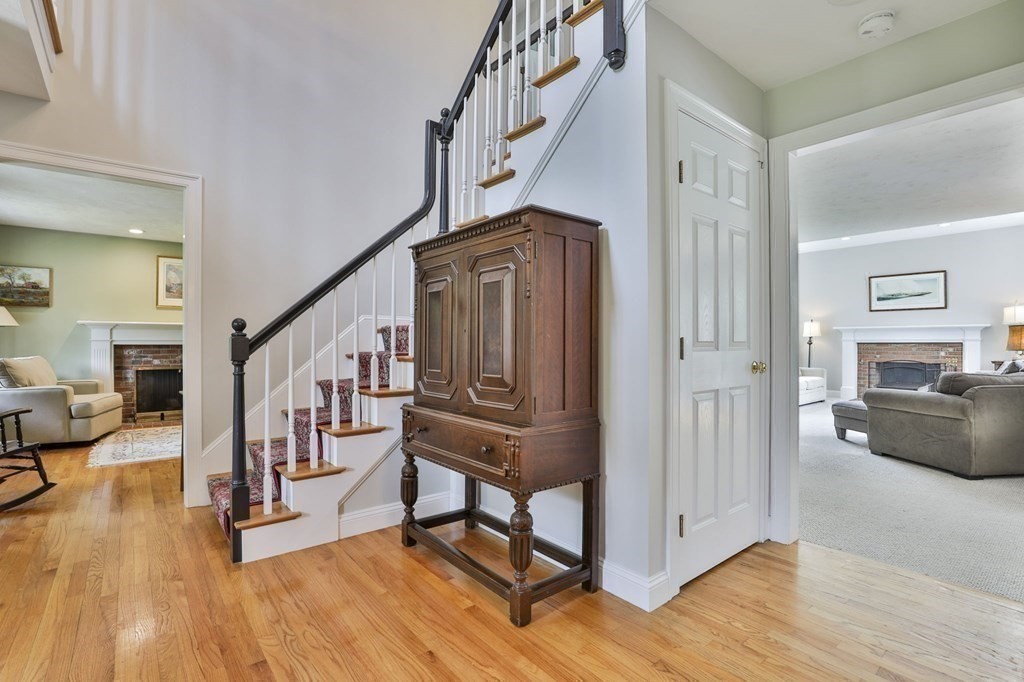 4 Breezy Point Road Acton, MA 01720 - Photo 21 of 40 a living room with furniture and a wooden floor