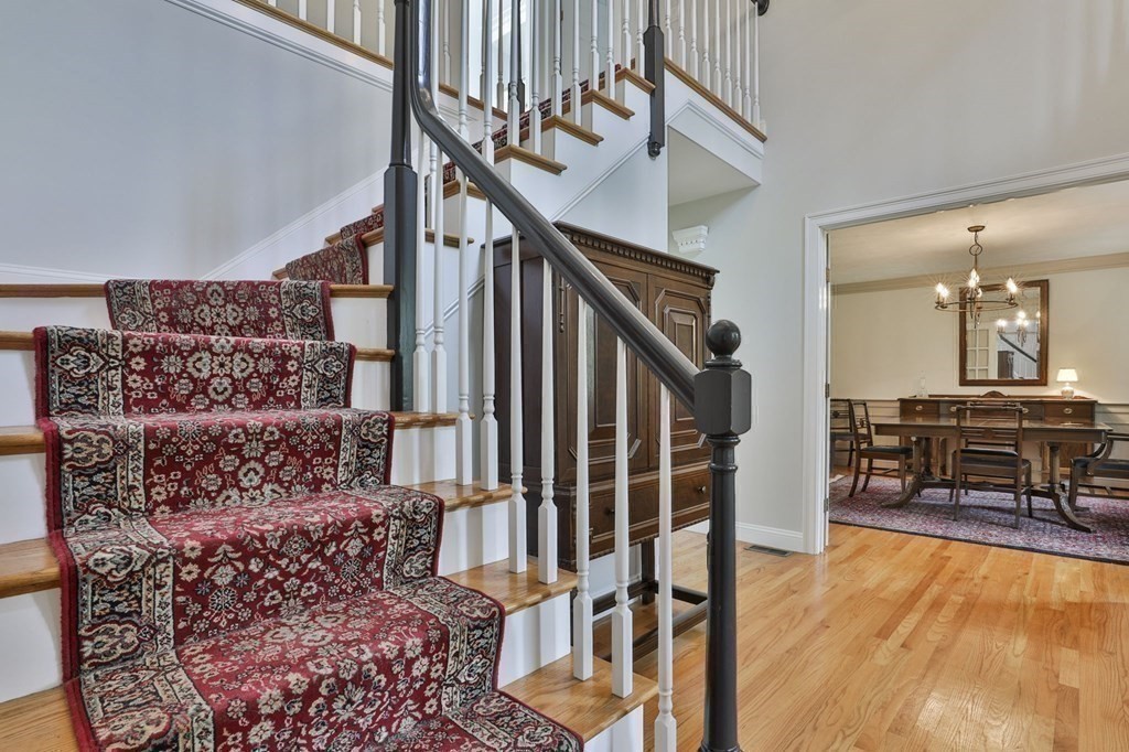 4 Breezy Point Road Acton, MA 01720 - Photo 22 of 40 a view of livingroom with furniture and stairs