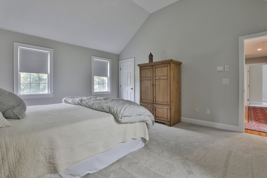 4 Breezy Point Road Acton, MA 01720 - Photo 27 of 40 a bedroom with a bed and a window
