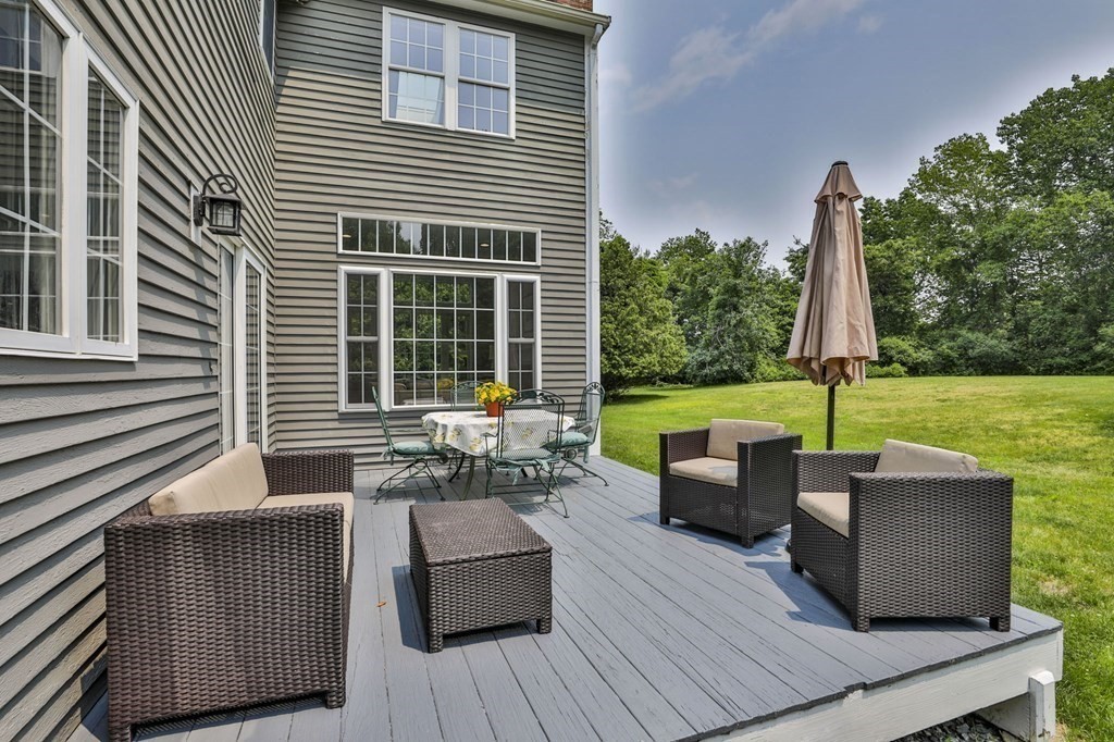 4 Breezy Point Road Acton, MA 01720 - Photo 3 of 40 a view of a patio with couches potted plants and wooden roof