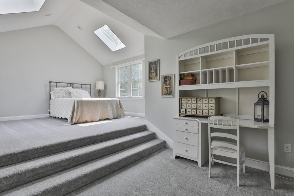 4 Breezy Point Road Acton, MA 01720 - Photo 31 of 40 a bedroom with a bed and a book shelf