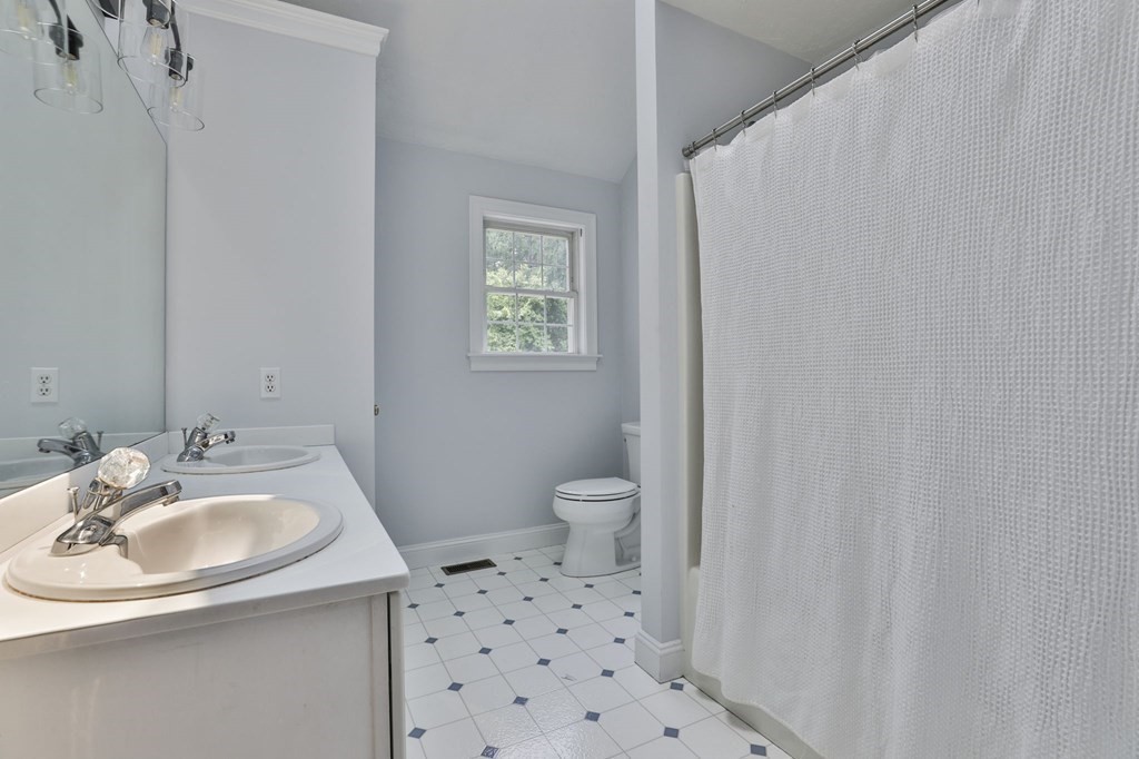4 Breezy Point Road Acton, MA 01720 - Photo 34 of 40 a bathroom with a sink toilet and shower