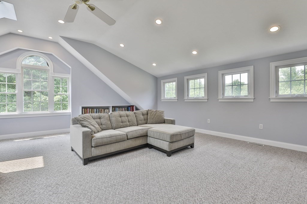 4 Breezy Point Road Acton, MA 01720 - Photo 37 of 40 a living room with furniture and a large window