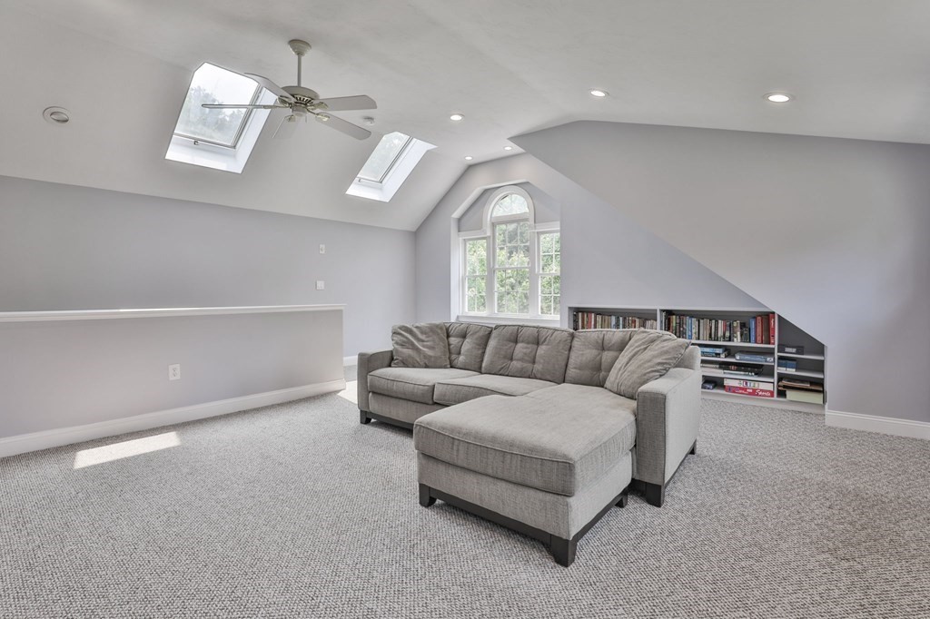 4 Breezy Point Road Acton, MA 01720 - Photo 38 of 40 a living room with furniture and a large window
