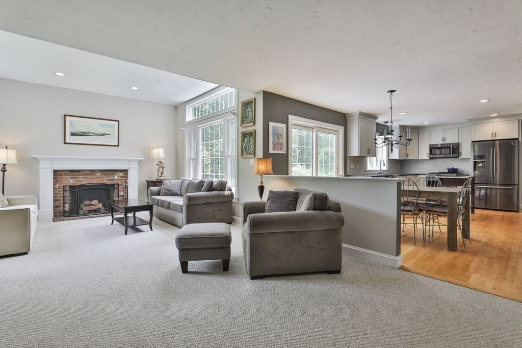 4 Breezy Point Road Acton, MA 01720 - Photo 9 of 40 a living room with furniture and a fireplace