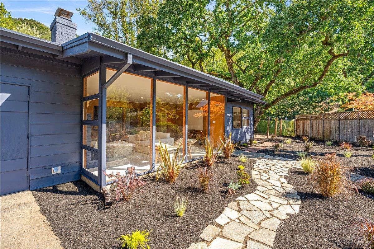 84 Canyon Road Fairfax, CA 94930 - Photo 1 of 1 a view of roof deck with table and chairs and potted plants