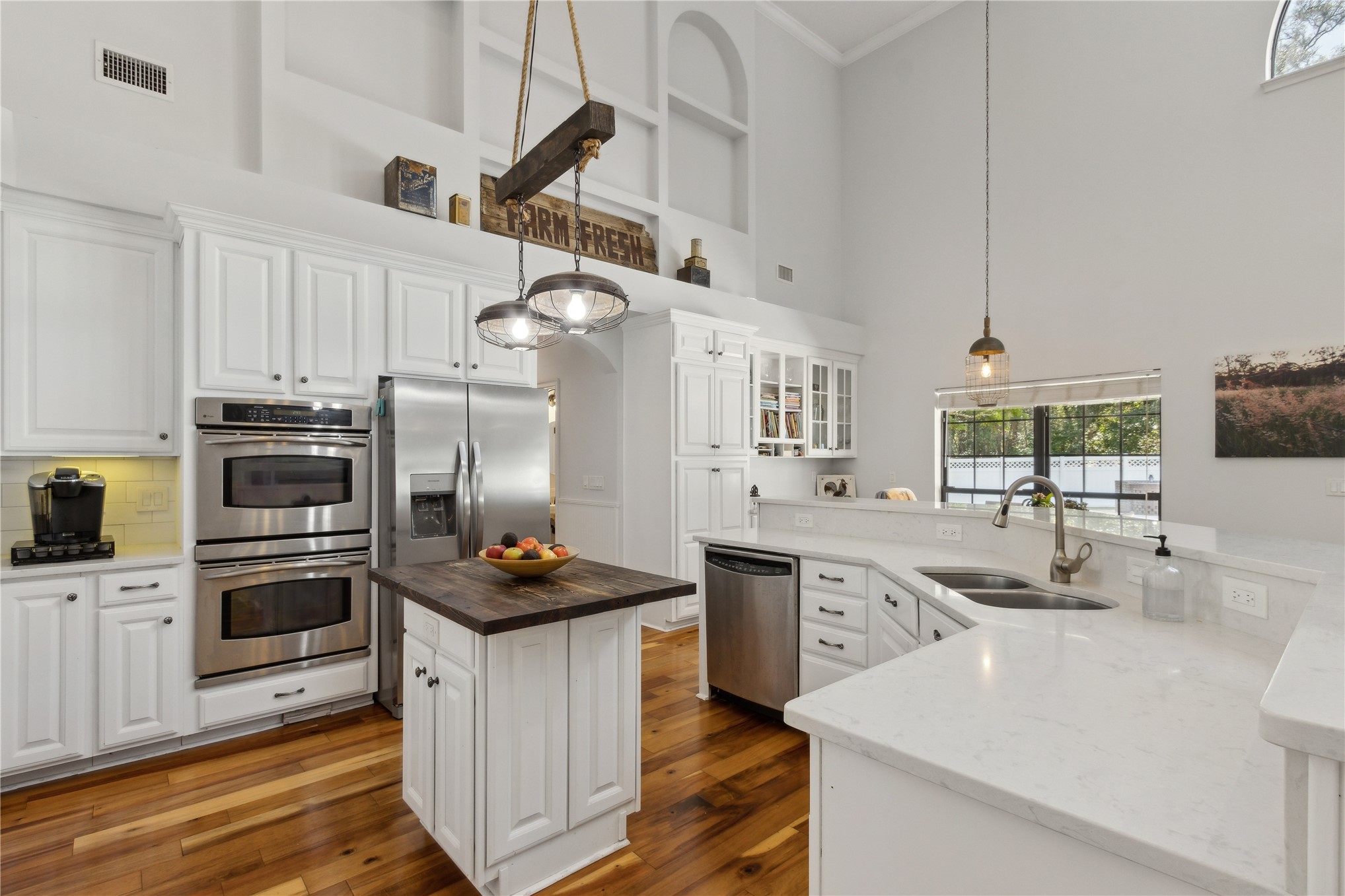 87377 Raddin Road Yulee, FL 32097 - Photo 28 of 75 a kitchen with kitchen island granite countertop a sink appliances cabinets and counter space