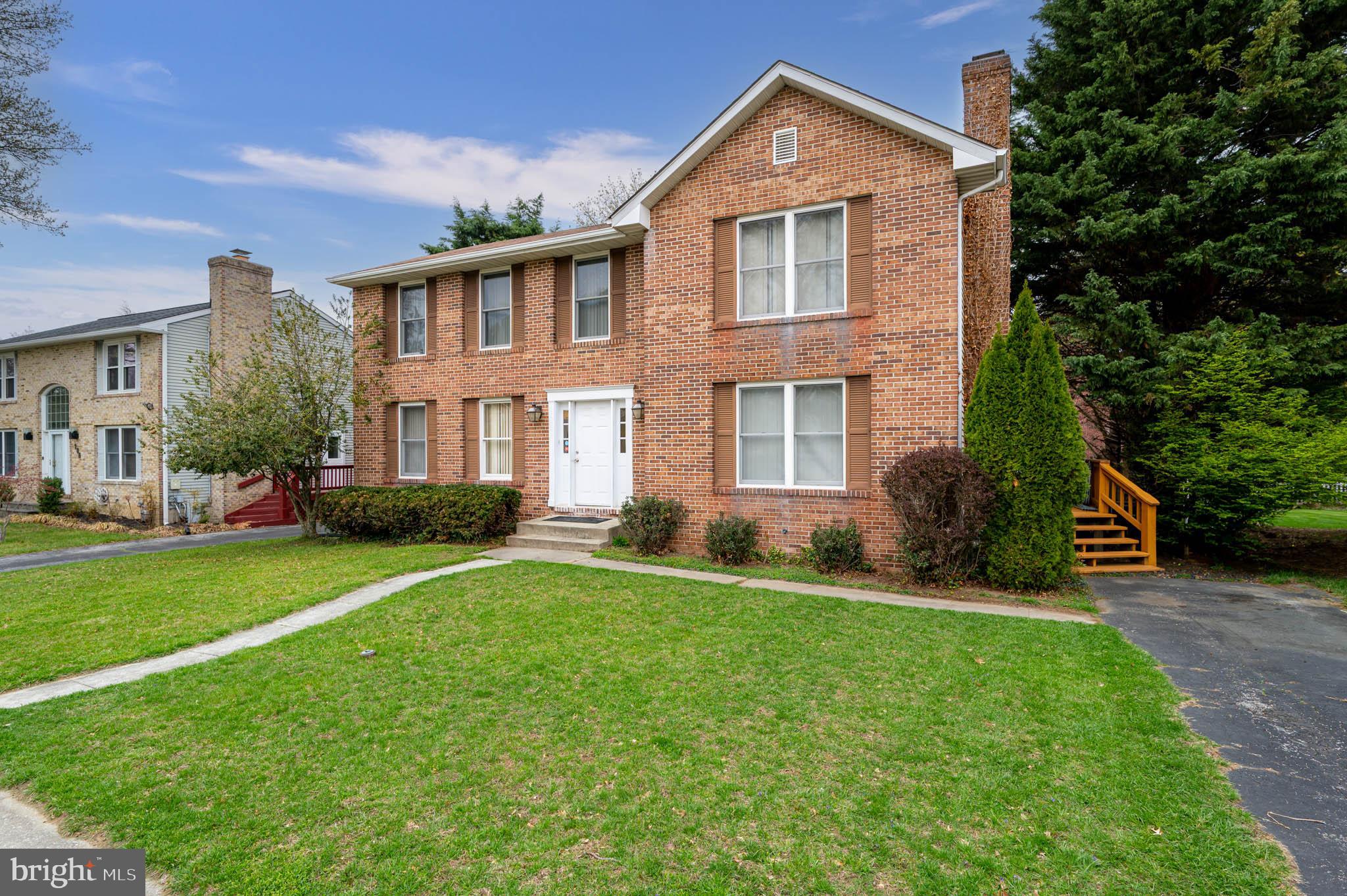 208 Berry Vine Drive Owings Mills, MD 21117 - Photo 1 of 45 a front view of a house with a yard