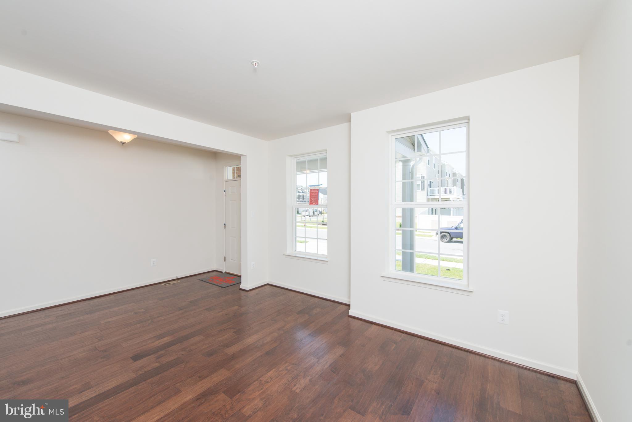 910 Ramble Run Road Baltimore, MD 21220 - Photo 2 of 30 an empty room with windows