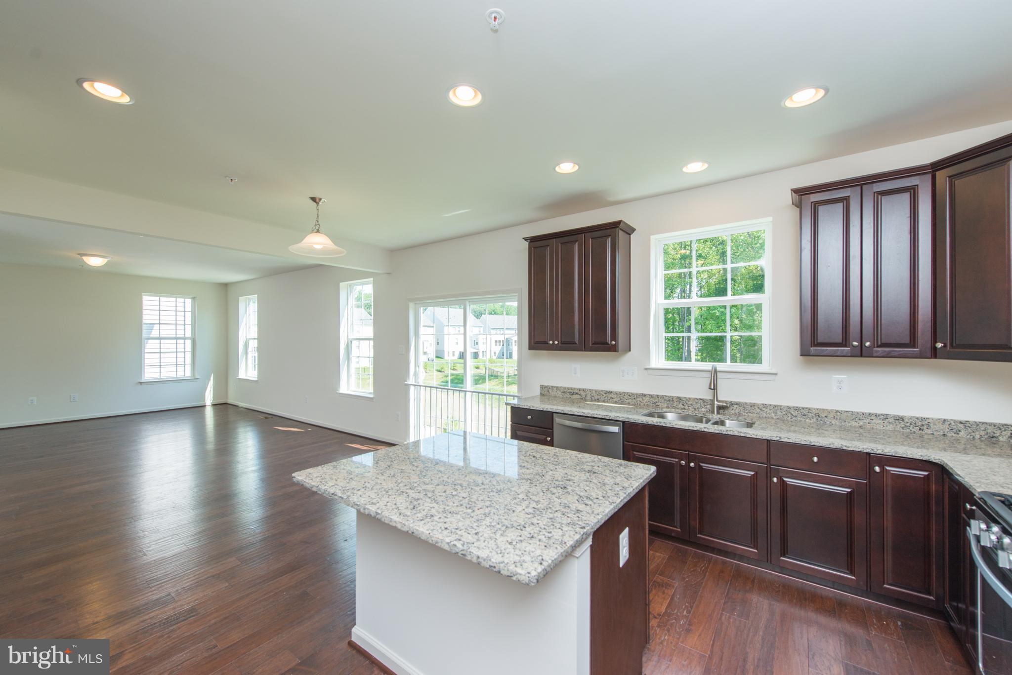 910 Ramble Run Road Baltimore, MD 21220 - Photo 11 of 30 a kitchen with lots of counter space and a sink