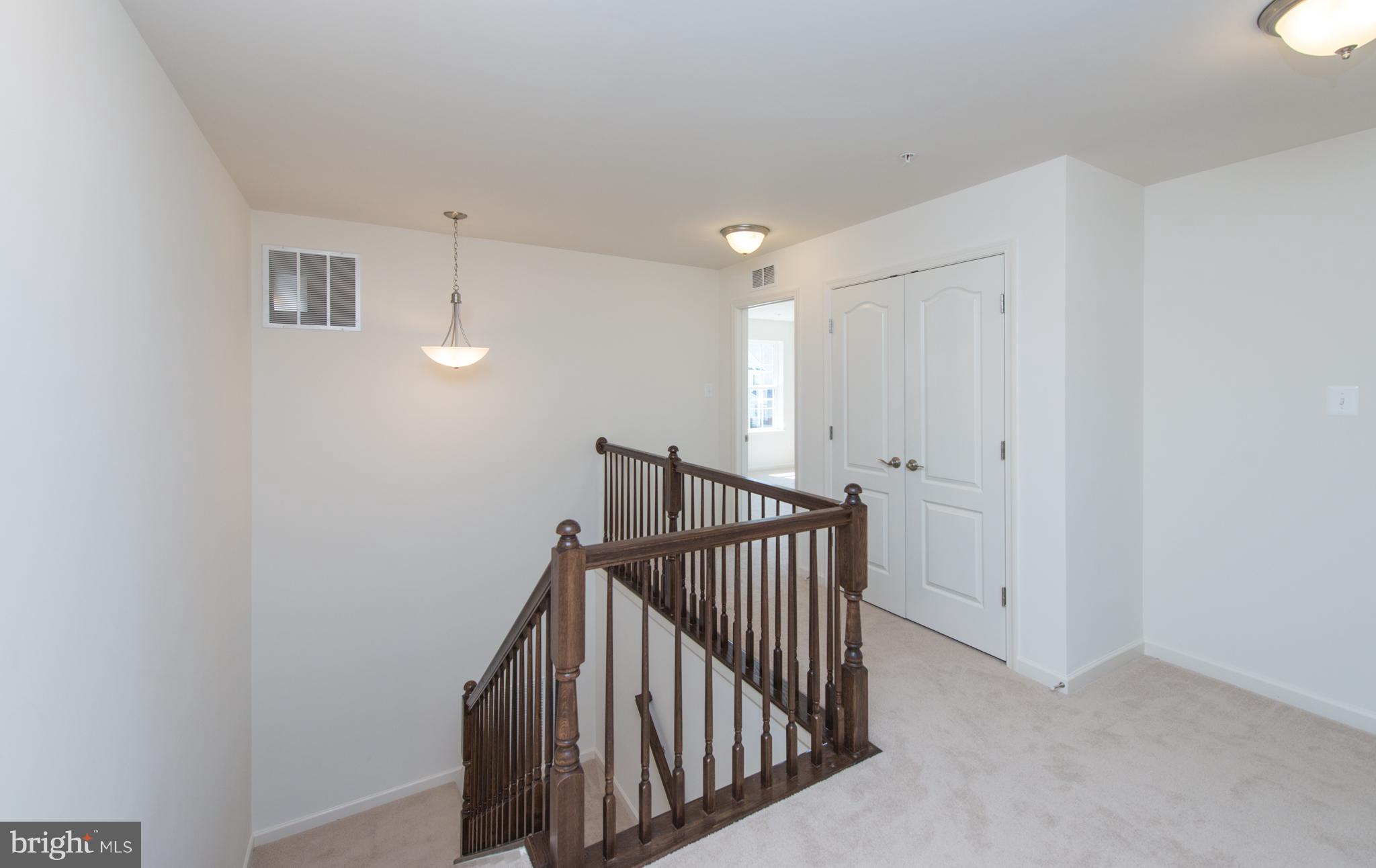 910 Ramble Run Road Baltimore, MD 21220 - Photo 13 of 30 a view of a hallway with staircase