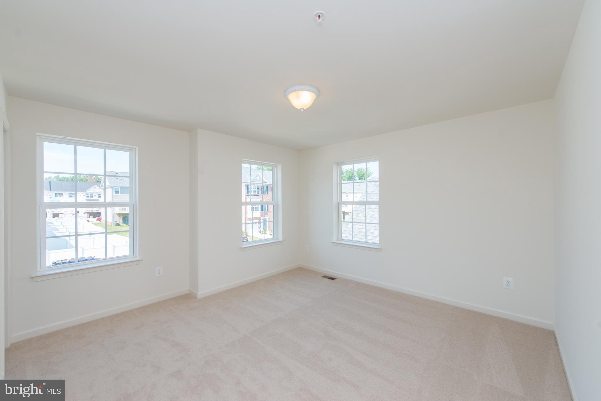 910 Ramble Run Road Baltimore, MD 21220 - Photo 14 of 30 a view of an empty room with a window