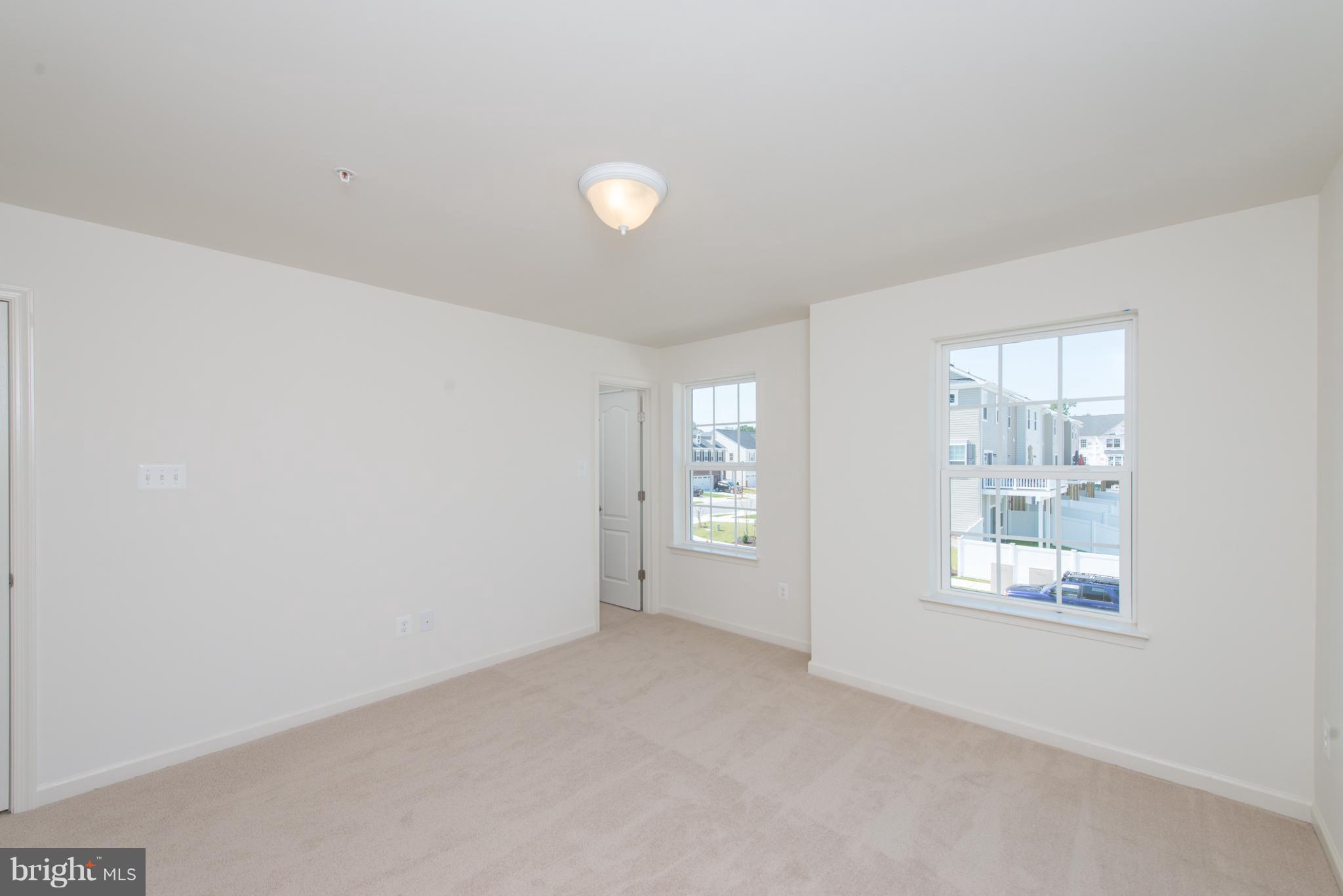 910 Ramble Run Road Baltimore, MD 21220 - Photo 15 of 30 an empty room with windows