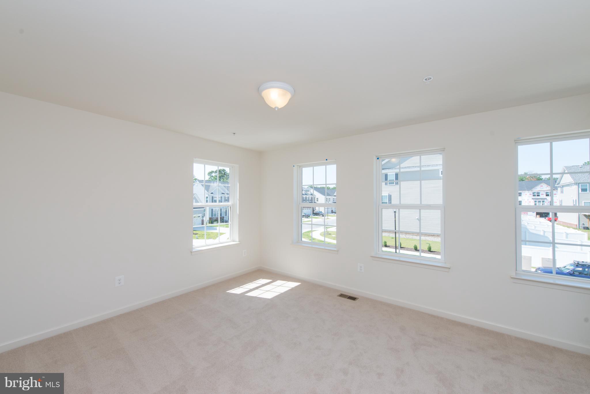 910 Ramble Run Road Baltimore, MD 21220 - Photo 18 of 30 an empty room with windows