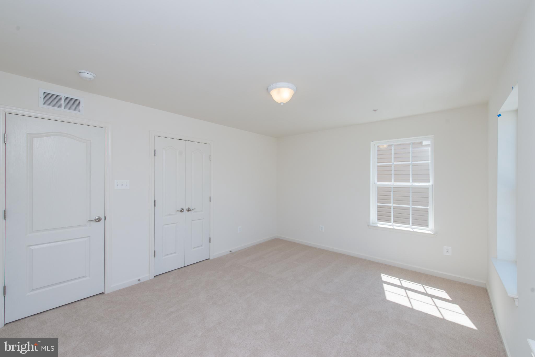 910 Ramble Run Road Baltimore, MD 21220 - Photo 19 of 30 a view of an empty room with a window