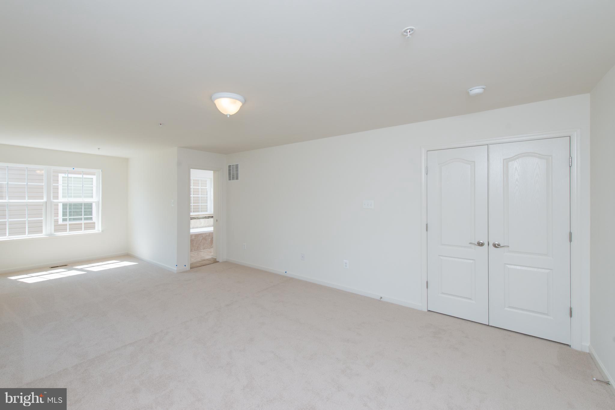 910 Ramble Run Road Baltimore, MD 21220 - Photo 23 of 30 a view of an empty room with a window