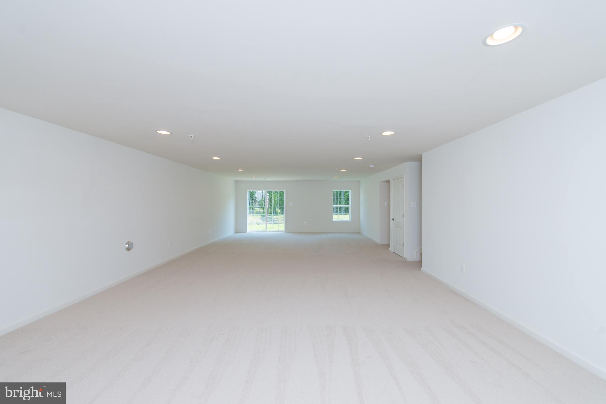 910 Ramble Run Road Baltimore, MD 21220 - Photo 28 of 30 a view of a big room with windows and closet