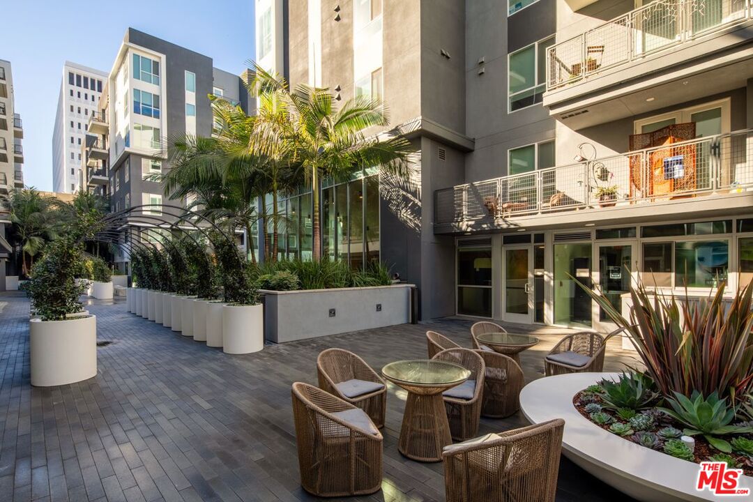 1120 West 6th Street, Unit 2151 Los Angeles, CA 90017 - Photo 14 of 51 a view of a patio with couches table and chairs and potted plants
