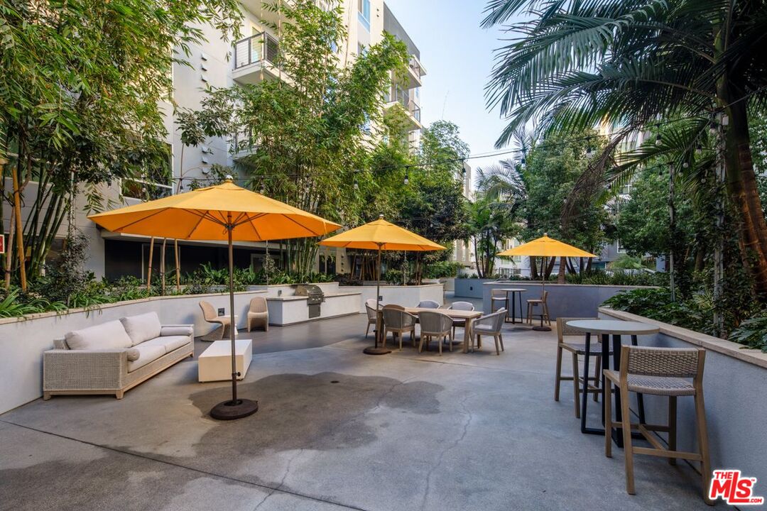 1120 West 6th Street, Unit 2151 Los Angeles, CA 90017 - Photo 20 of 51 a swimming pool with outdoor seating water slide and yard