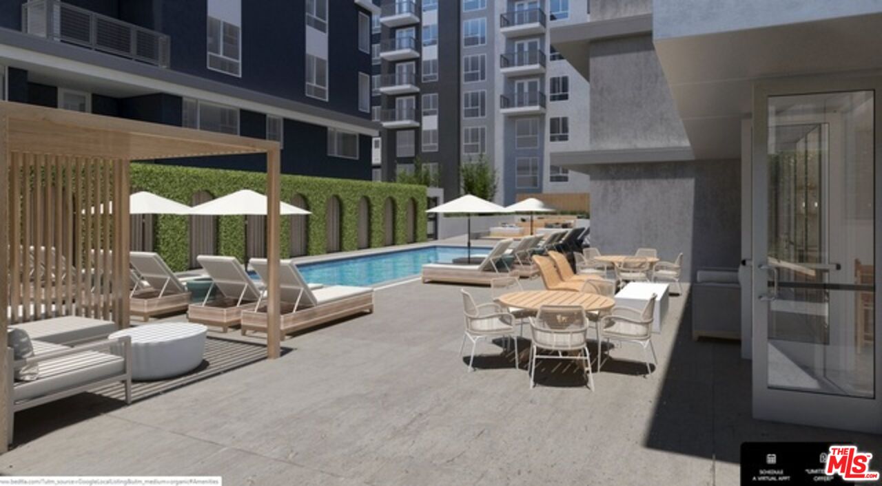 1120 West 6th Street, Unit 2151 Los Angeles, CA 90017 - Photo 48 of 51 a view of a patio with couches table and chairs and potted plants