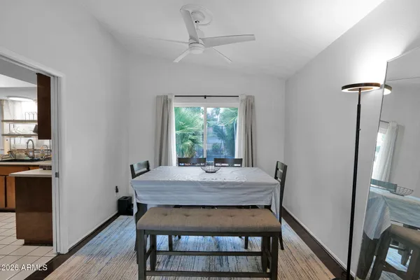 a view of a dining room with furniture window and wooden floor