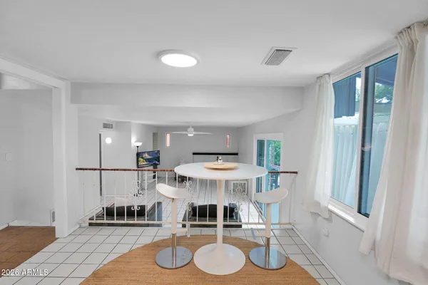 a living room with furniture and a table