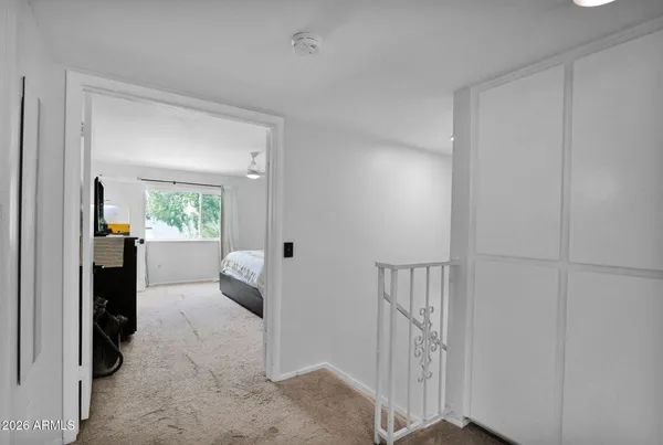 a view of a hallway view with staircase