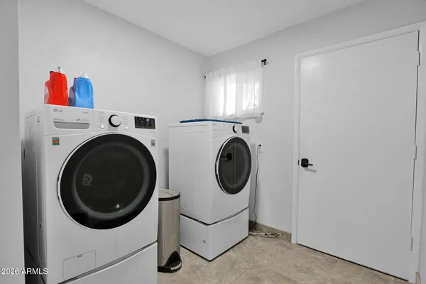a utility room with dryer and washer