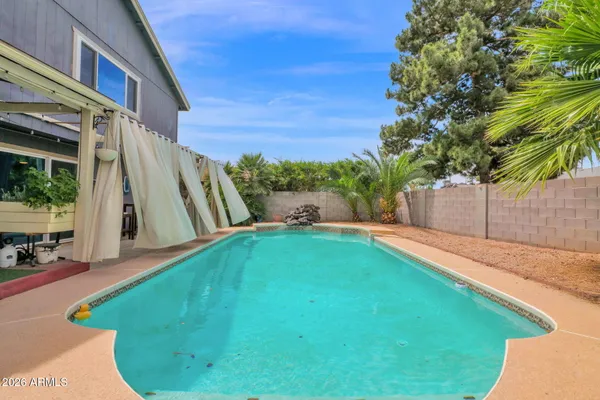 a view of a backyard with a patio
