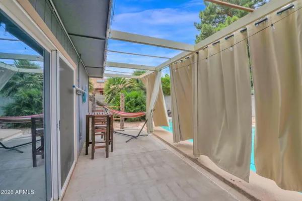 a view of a backyard with a fountain