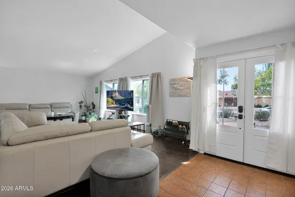 a living room with furniture and a large window