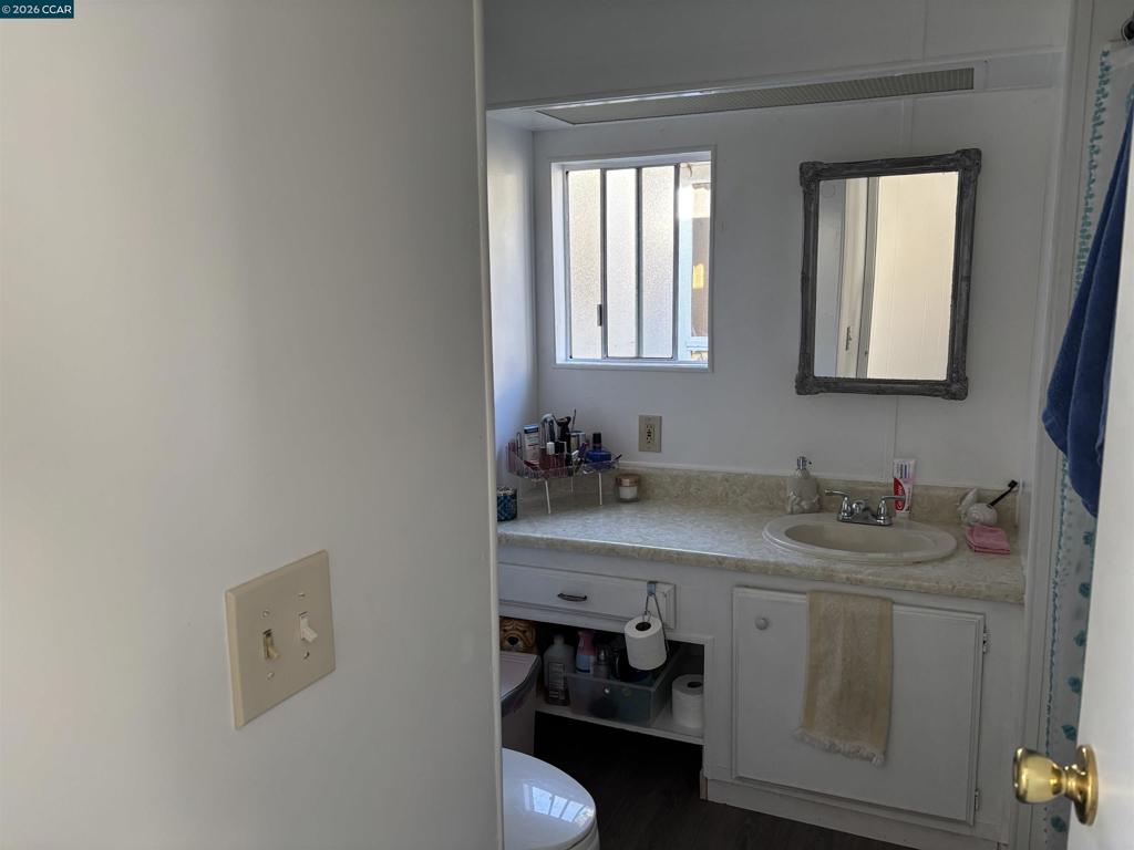 2990 San Pablo Dam Road San Pablo, CA 94803 - Photo 8 of 13 a bathroom with a sink and a mirror