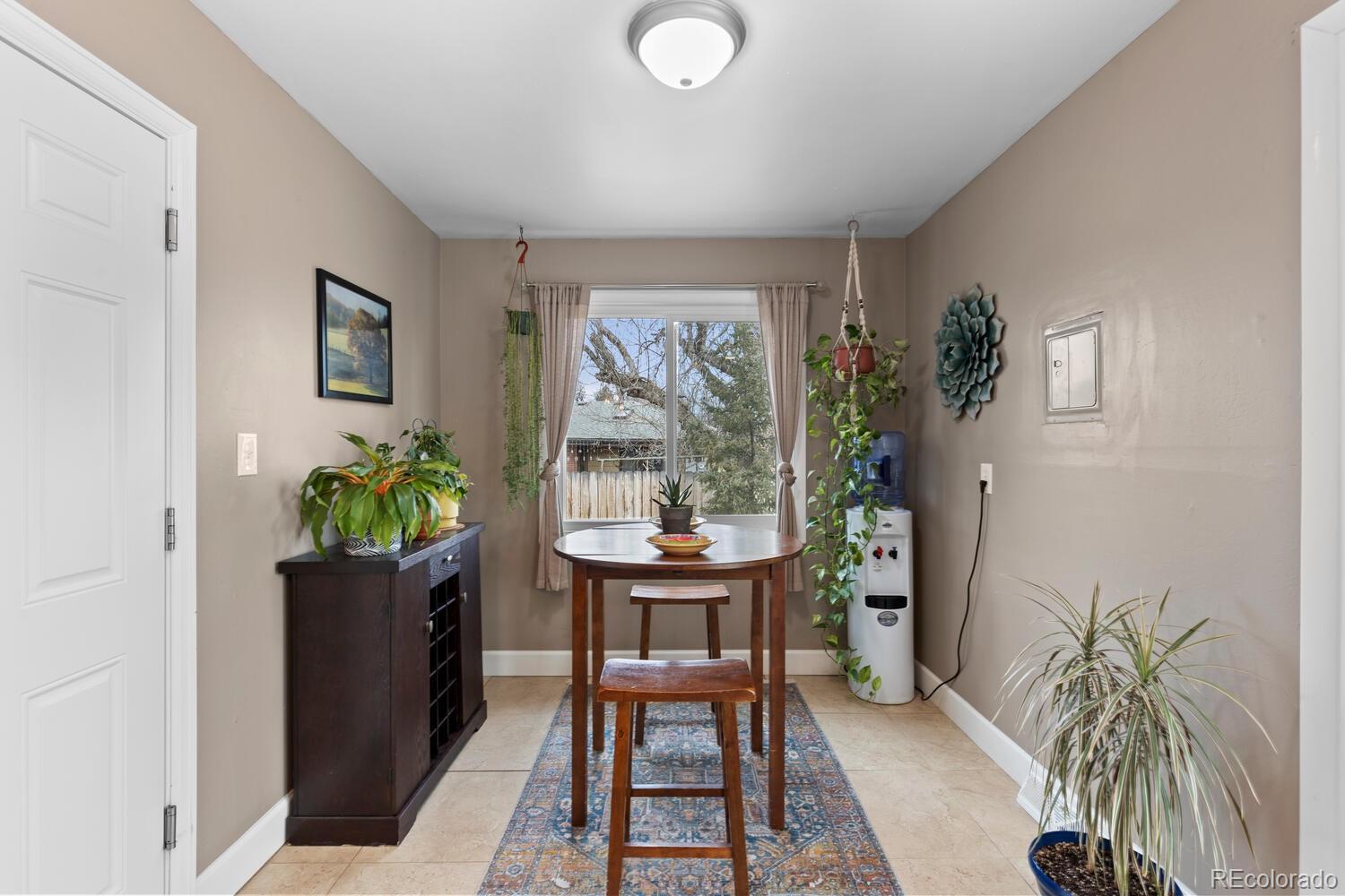 236 Lima Street Aurora, CO 80010 - Photo 13 of 50 a dining room with furniture and window