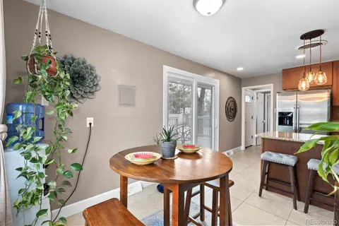 a view of a dining room with furniture and chandelier