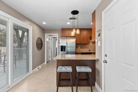 a view of a kitchen from the hallway