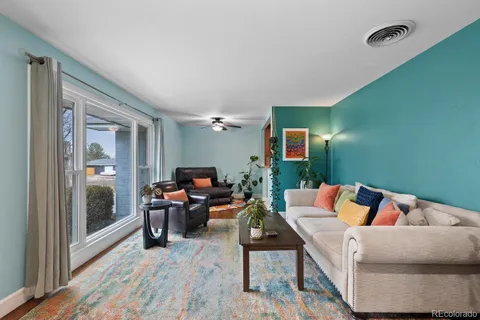 a reading room with furniture and wooden floor
