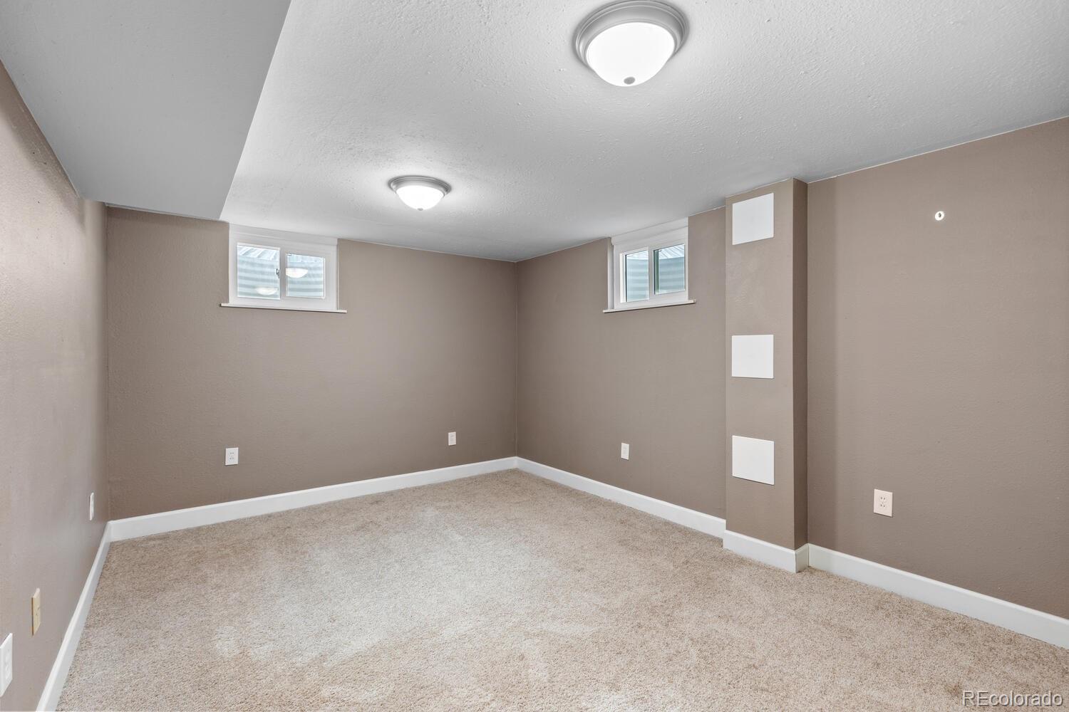 236 Lima Street Aurora, CO 80010 - Photo 33 of 50 an empty room with windows and closet