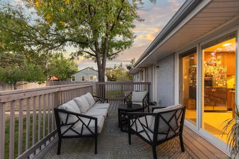 a view of a yard with wooden fence
