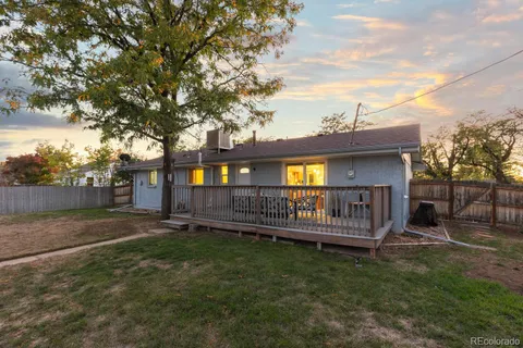 a front view of a house with a garden and porch