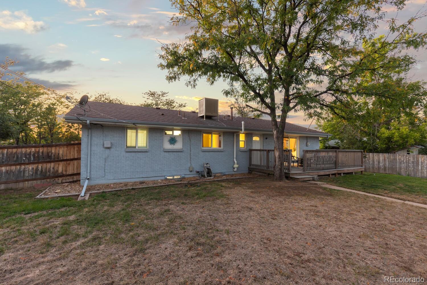 236 Lima Street Aurora, CO 80010 - Photo 42 of 50 a view of a yard with wooden fence