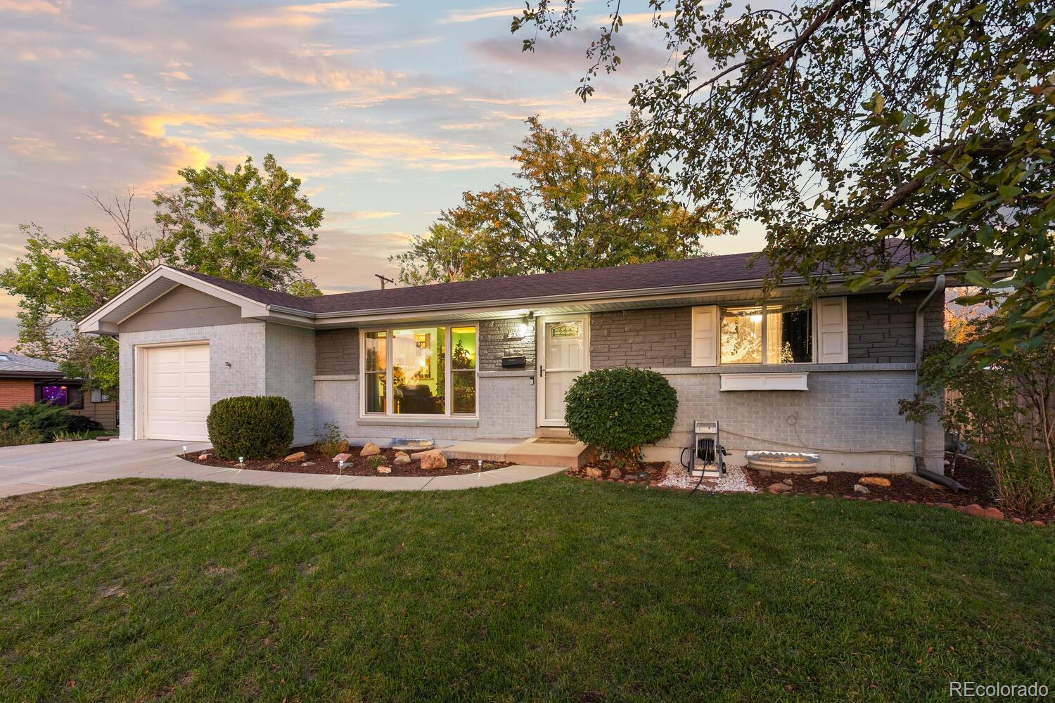 236 Lima Street Aurora, CO 80010 - Photo 44 of 50 a front view of house with yard and outdoor seating