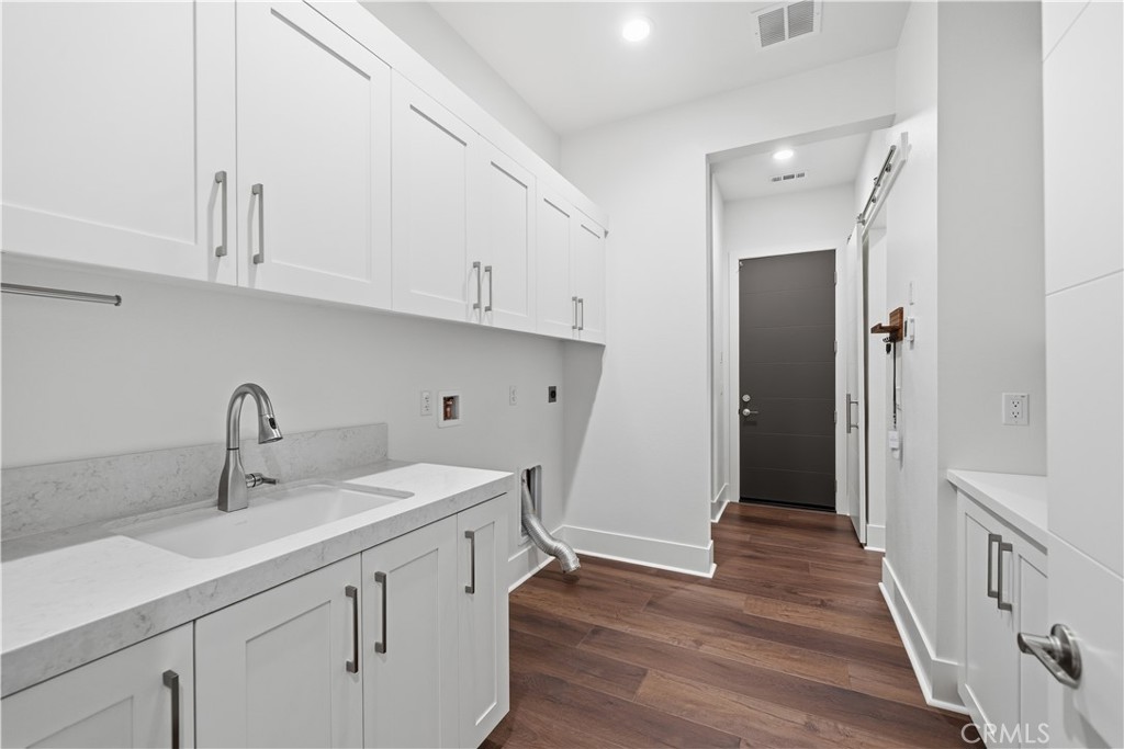 32225 Daybrook Terrace Temecula, CA 92591 - Photo 49 of 75 Laundry room-tons of additional cabinetry, custom barnwood finishes